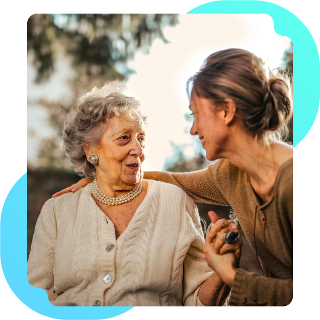 A woman providing care to an elderly woman who needs assistance with daily living activities