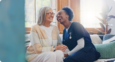 A nurse caring for an elderly woman who needs daily assistance