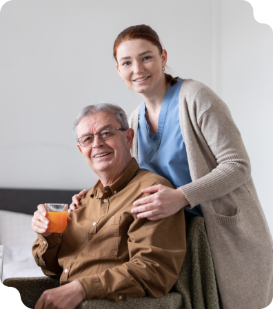 A nurse caring for an elderly man who needs daily assistance